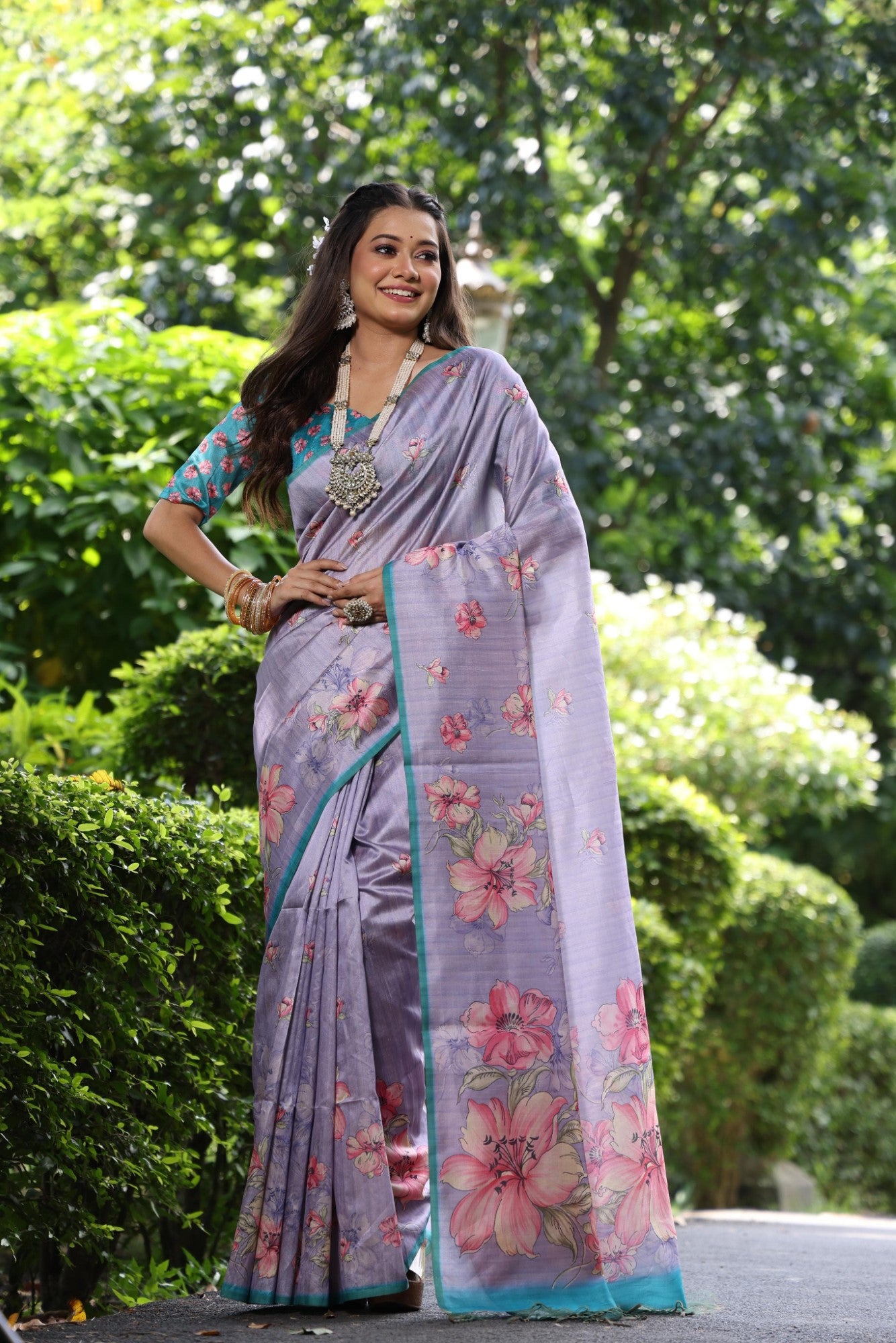 Soft tussar silk fabric with floral print pallu and printed border with flower butties work saree