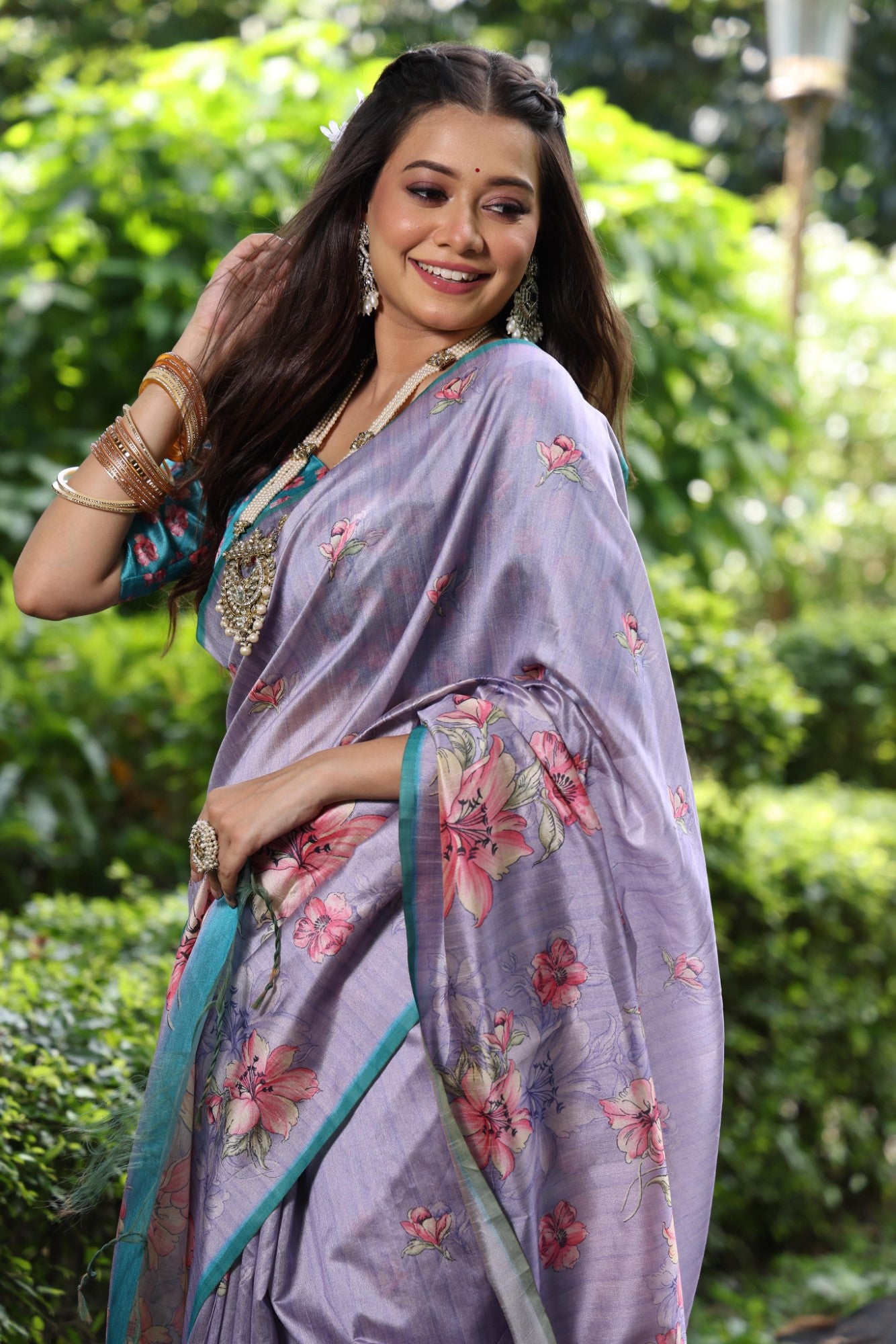 Soft tussar silk fabric with floral print pallu and printed border with flower butties work saree
