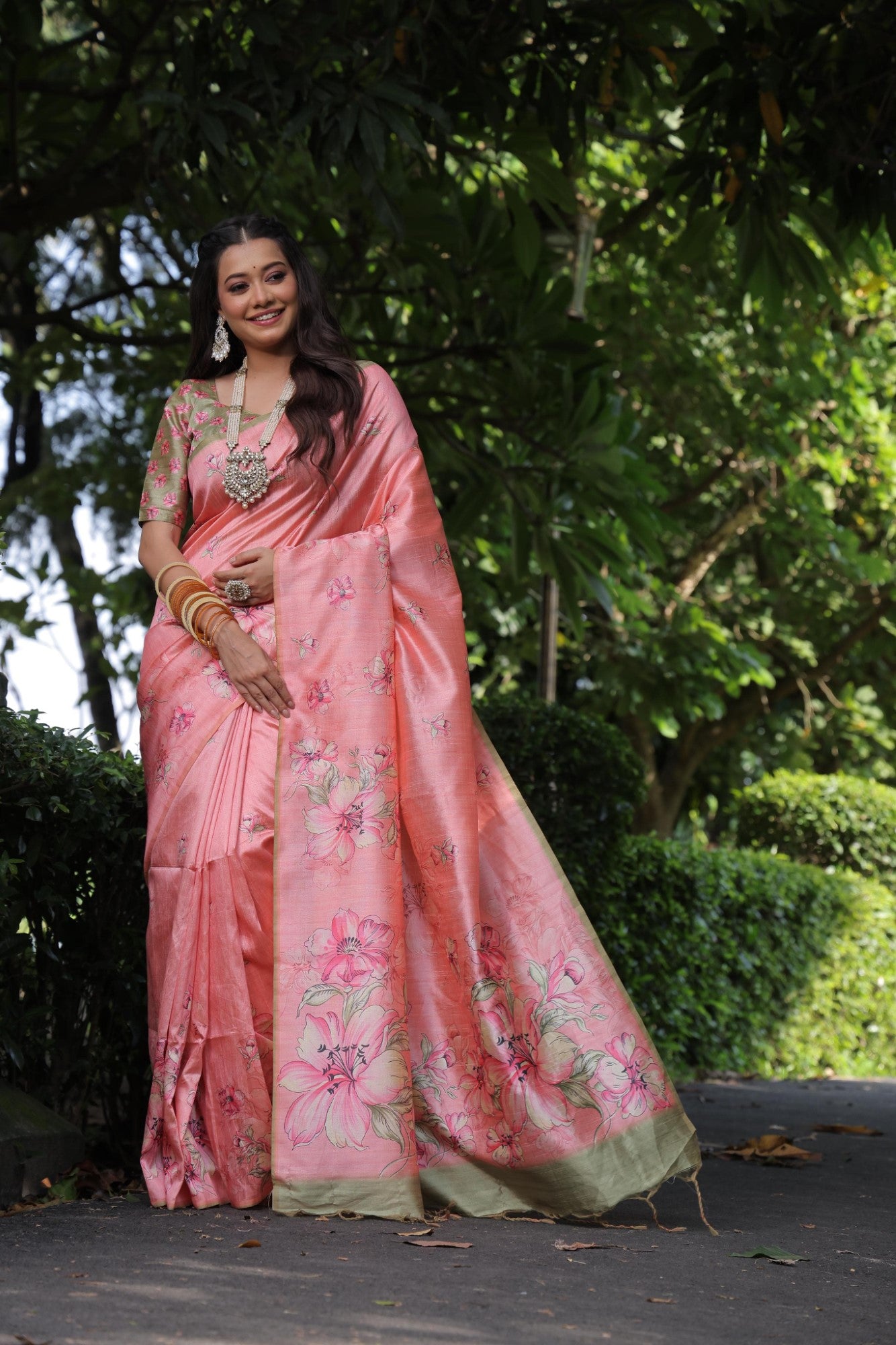 Soft tussar silk fabric with floral print pallu and printed border with flower butties work saree