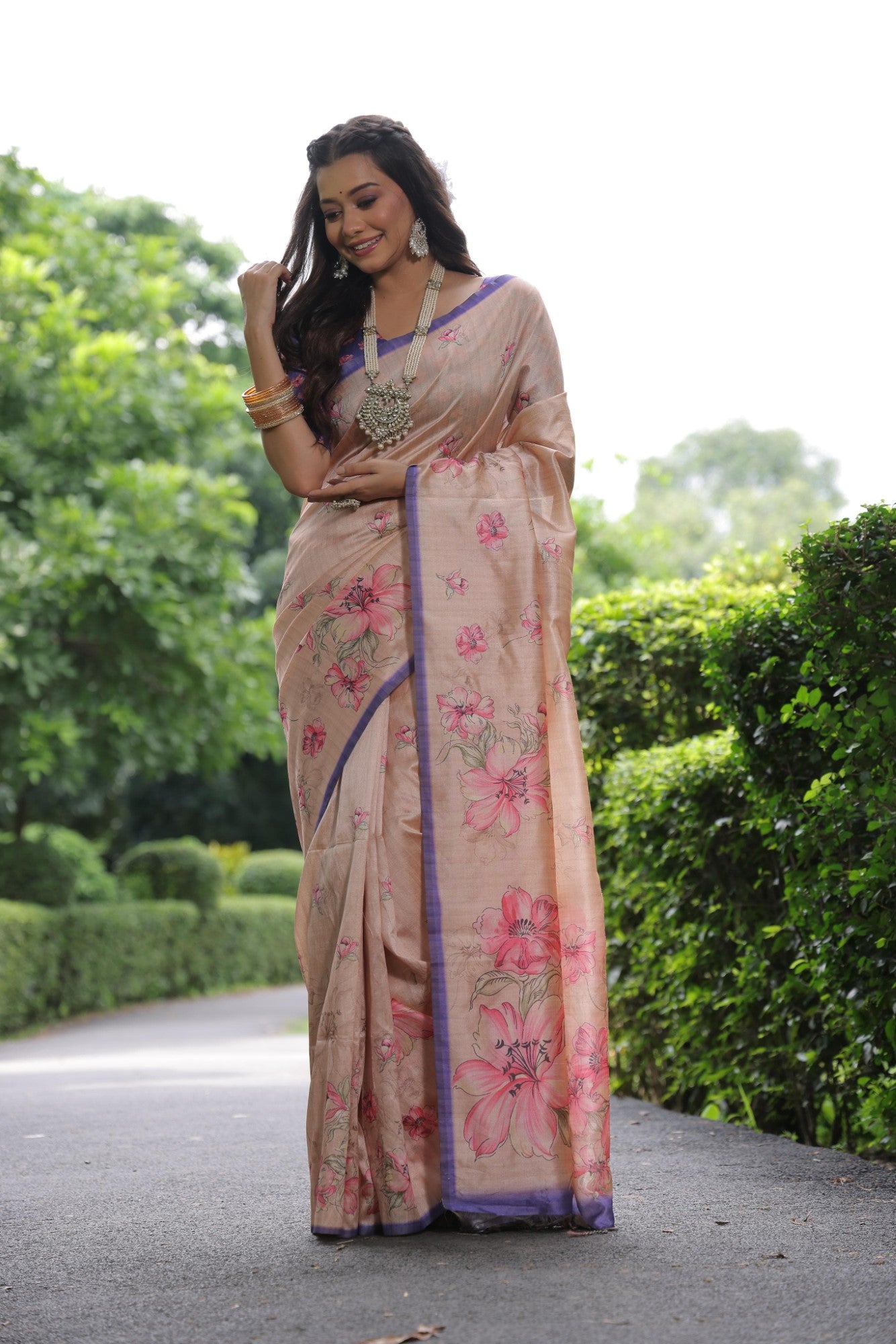 Soft tussar silk fabric with floral print pallu and printed border with flower butties work saree