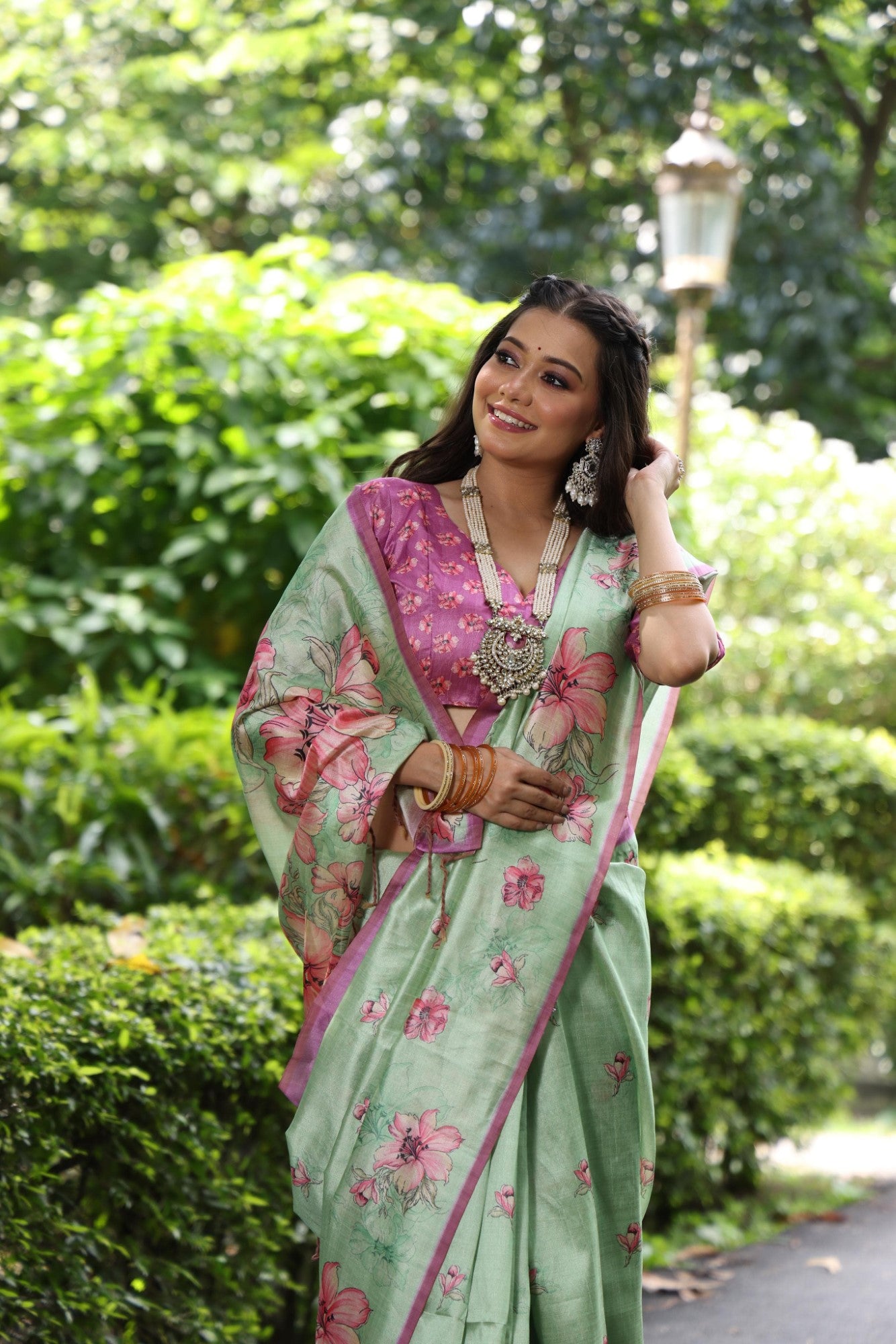 Soft tussar silk fabric with floral print pallu and printed border with flower butties work saree